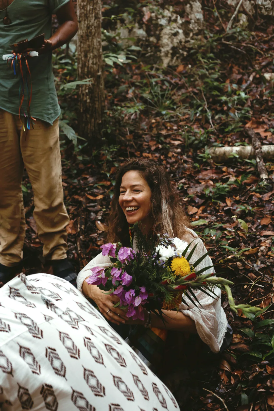 After the ceremony — a woman receives flowers at sunrise