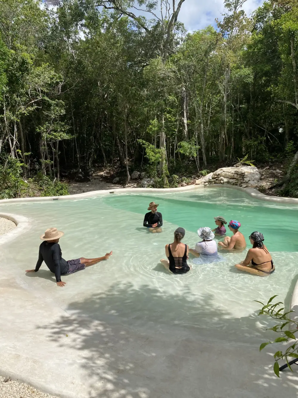 Janzu aquatic bodywork in the cenote-fed pool at Casa Arkaana