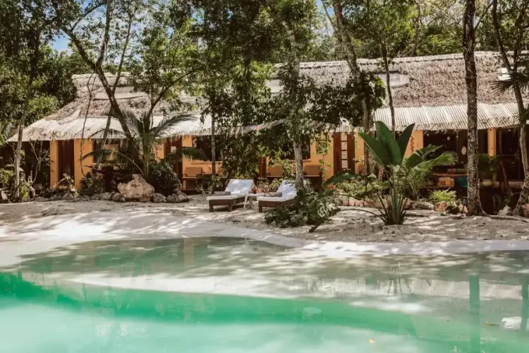 The cenote-fed pool at Casa Arkaana — your base for seven days